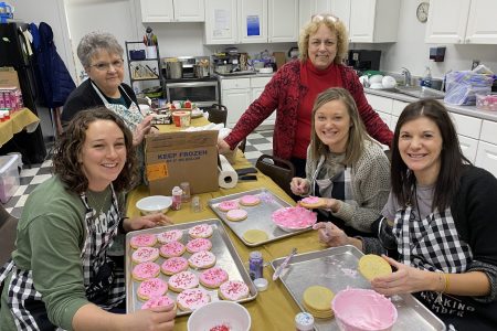 Jane, Deb, and teachers with cookies