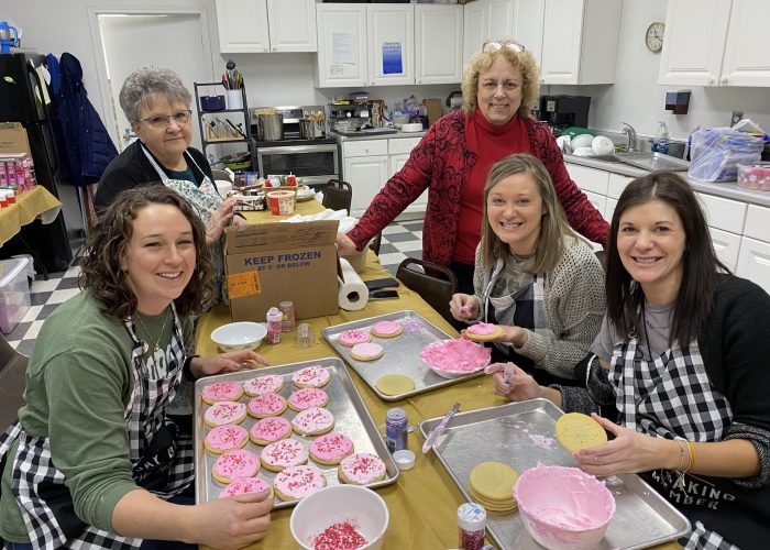 Jane, Deb, and teachers with cookies
